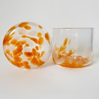 two glasses with orange and white flowers on them